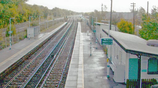 Salfords station, 2004. View southwards, towards Gatwick, Brighton etc.: ex-LB&SCR London - Brighton etc. main line. The station has platforms on the Slow lines only, which run through Redhill. It was opened in 1915 as an unadvertised Halt for local factories and only opened to the public in 1932, the suffix 'Halt' being dropped in 1935.