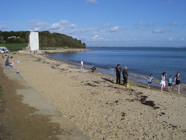 The beach at St Helen's, Isle of Wight. The white shape in the distance is what remains of the tower of old St Helen's church.