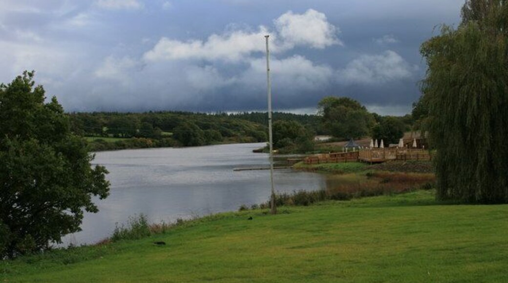 The old mill pond at Wootton A view looking across the mill pond with a glimpse of the new leisure complex on the right. I should probably have chopped down the flag pole before I took this picture.