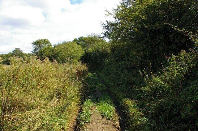 Debden Bridle Path. This bridle path runs to the south of the former Debden Aerodrome. Hedges and earth banks prevented any sight of the field but judging from the row at least part of the airfield is now used for (go)carting