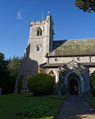 The tower and south porch of the Church of St Mary in Arkesden, Essex, England. Software: RAW file lens-corrected, optimized and converted to JPEG with DxO OpticsPro 10 Elite, and likely further optimized and/or cropped and/or spun with Adobe Photoshop CS2.