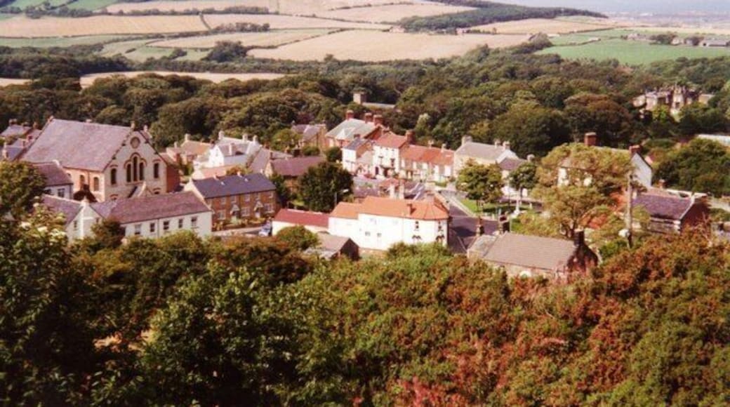 Looking down on Skelton Just before the Cleveland Way drops steeply into Skelton, one gets a birds eye view of the town, with an impressive chapel on the left and Skelton Castle on the right.