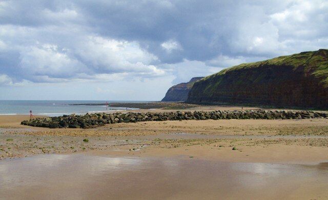 Rock Barrier at mouth of Kilton Beck Looking across the mouth of Kilton Beck to the rock barrier which helps protect the slipway and village houses at Skinningrove.