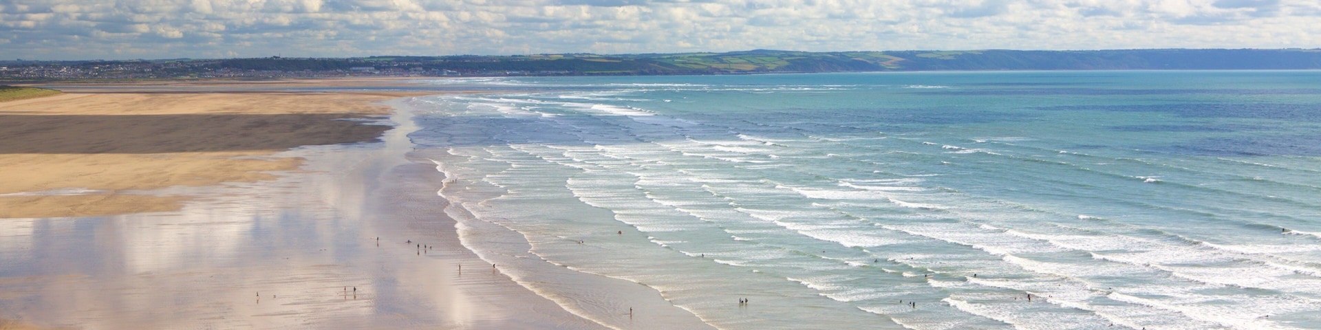 Saunton which includes landscape views and a sandy beach