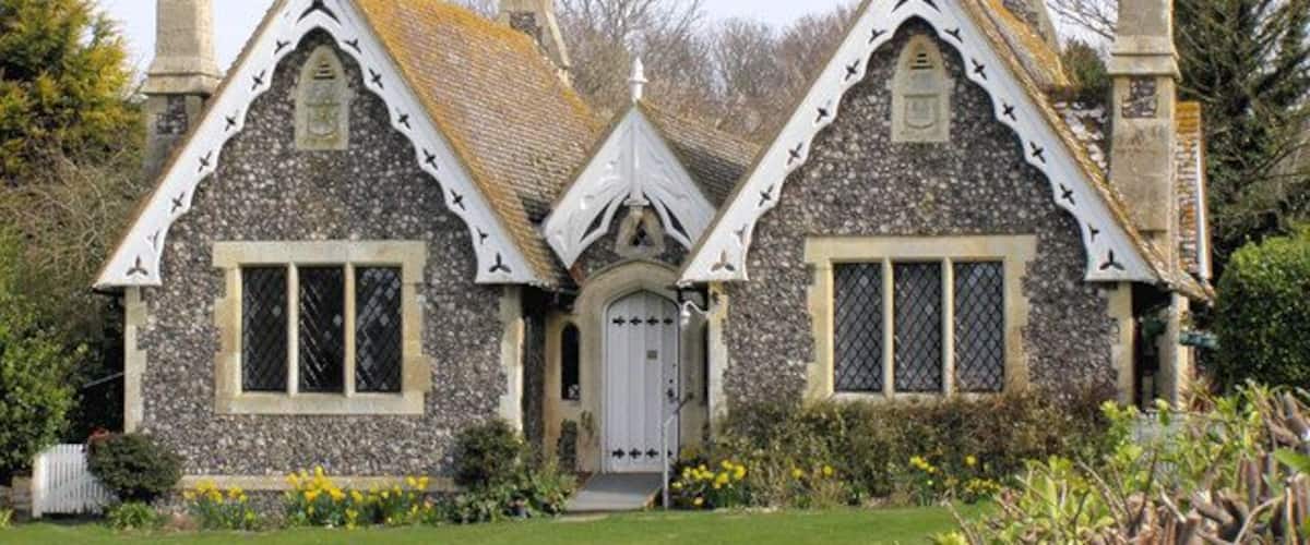 Almshouses, Bishopstone These almshouses on the Village Green were built as a memorial to the wife of William Catt. They were designed by the Victorian architect Ewan Christian.
