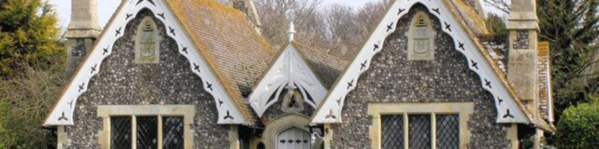 Almshouses, Bishopstone These almshouses on the Village Green were built as a memorial to the wife of William Catt. They were designed by the Victorian architect Ewan Christian.
