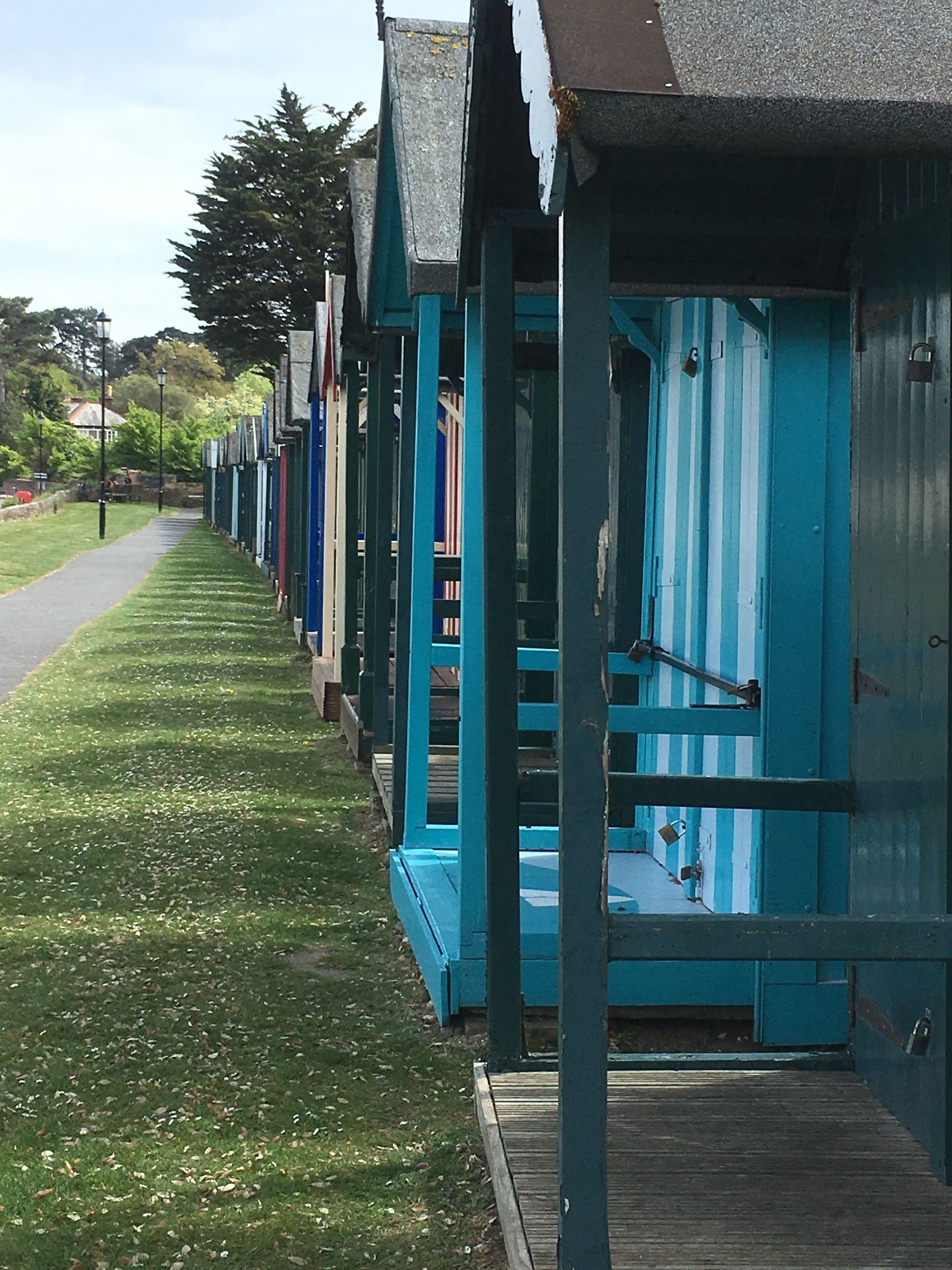 Line of beach huts overlooking The Solent