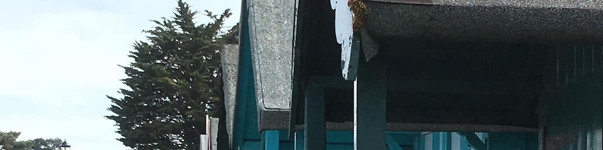 Line of beach huts overlooking The Solent