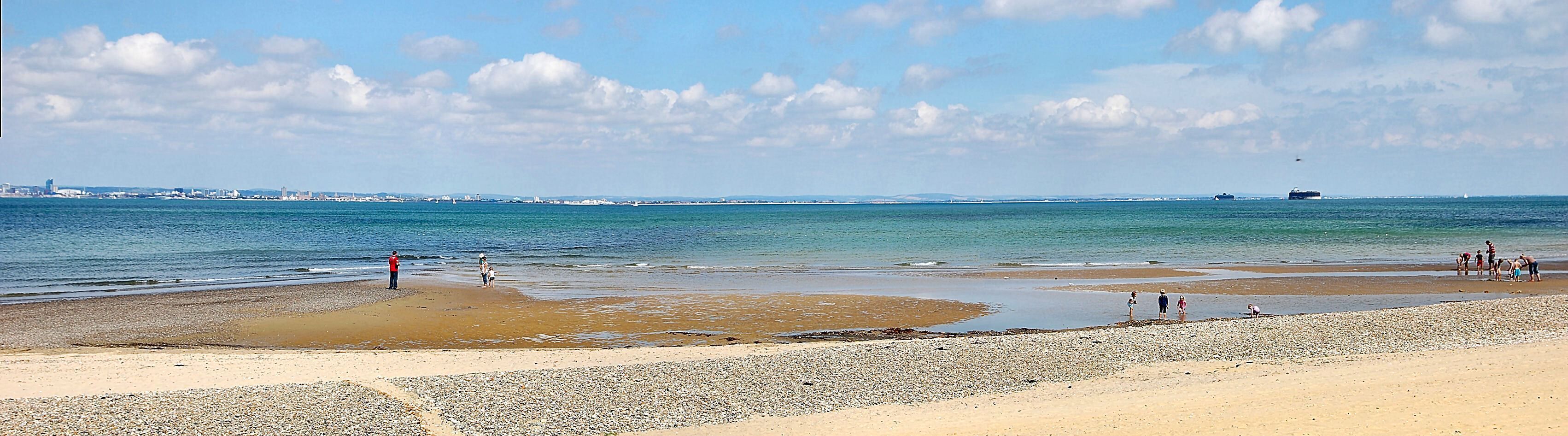 Looking towards Portsmouth and Southsea from the beach at Ryde on the Isle of Wight. Notice the two Martello Towers to the right. Built during the Napoleonic Wars to protect southern England from invasion by the French fleet in the early 1800s.