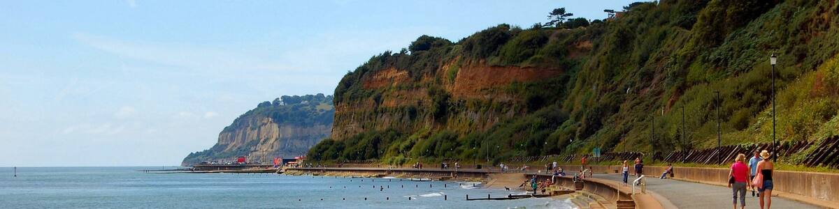 Sandown Bay is a broad bay which stretches for much of the length of the Isle of Wight's southeastern coast. It extends ten kilometres from Culver Cliff in the northeast to just south of Shanklin in the southwest. The towns of Shanklin and Sandown are located on the bay's coast. The seabed is a mixture of sand, shells and gravel. The beach is predominantly sand. The bay is best viewed from Culver Down to the north. The Isle of Wight Coastal Path follows the whole bayline either along the cliff top to the south of Sandown or the concrete seawall north of Sandown.