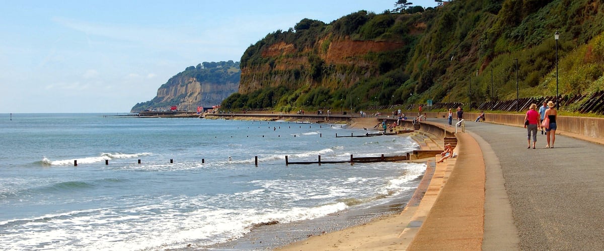 Sandown Bay is a broad bay which stretches for much of the length of the Isle of Wight's southeastern coast. It extends ten kilometres from Culver Cliff in the northeast to just south of Shanklin in the southwest. The towns of Shanklin and Sandown are located on the bay's coast. The seabed is a mixture of sand, shells and gravel. The beach is predominantly sand. The bay is best viewed from Culver Down to the north. The Isle of Wight Coastal Path follows the whole bayline either along the cliff top to the south of Sandown or the concrete seawall north of Sandown.