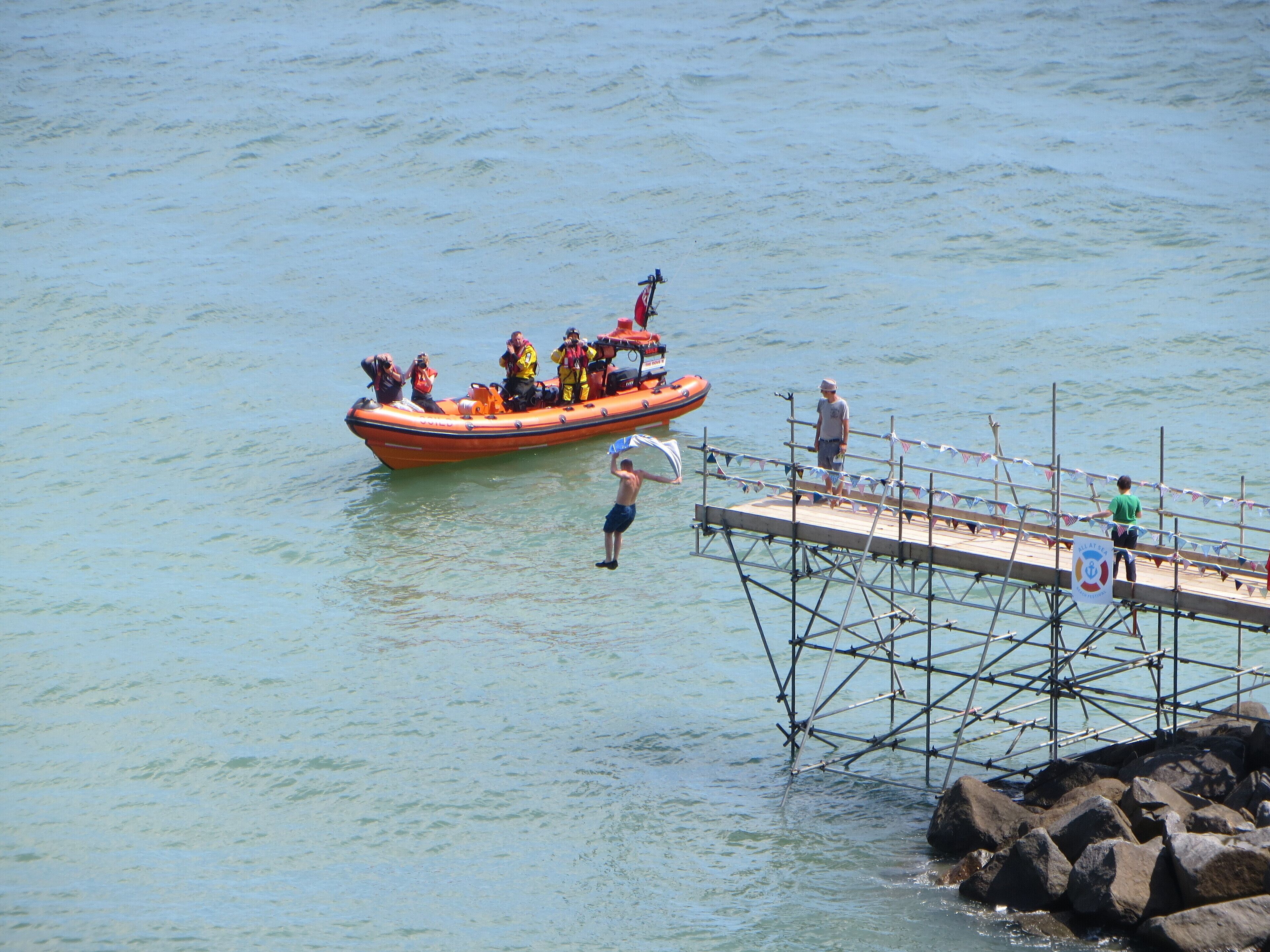 Competitor "Chelsea Blue" makes the jump at Small Hope Beach, Shanklin on 4 July 2015. Part of the All at Sea Beach Festival.