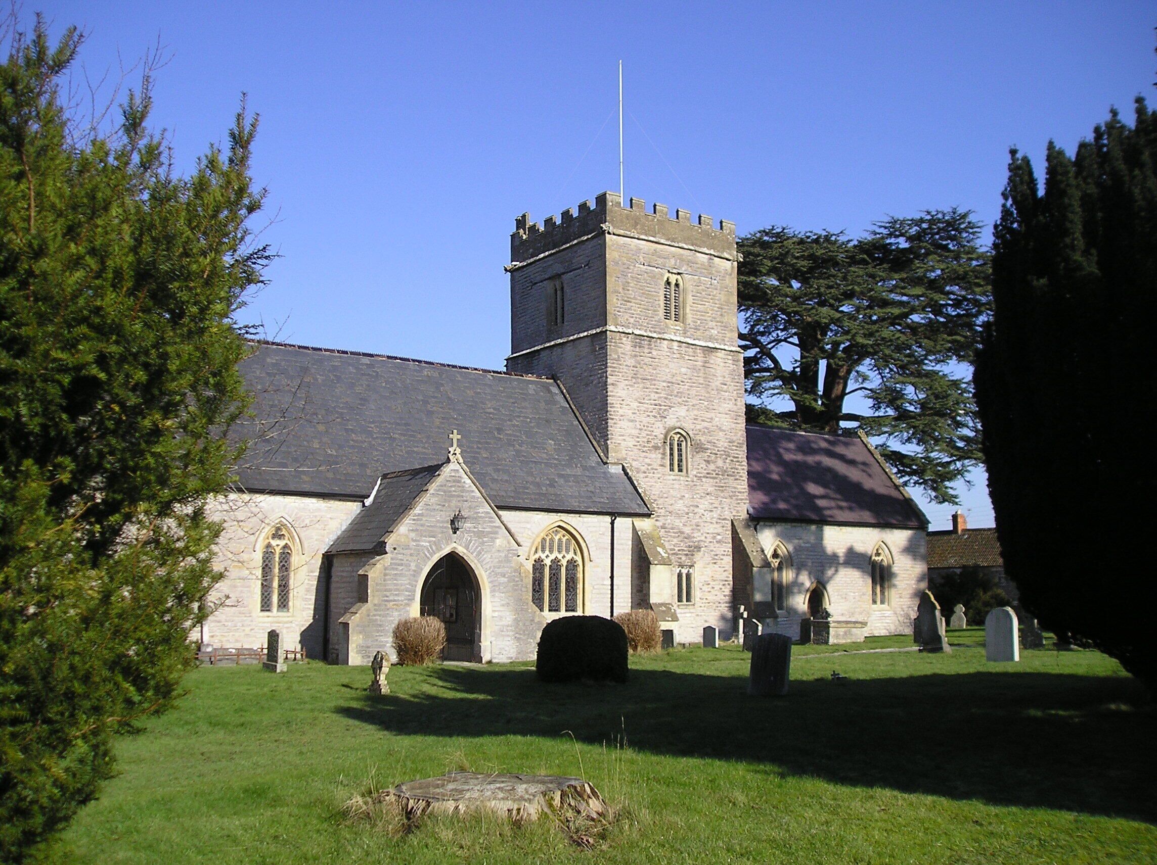 A church with a tall tower and arched windows.