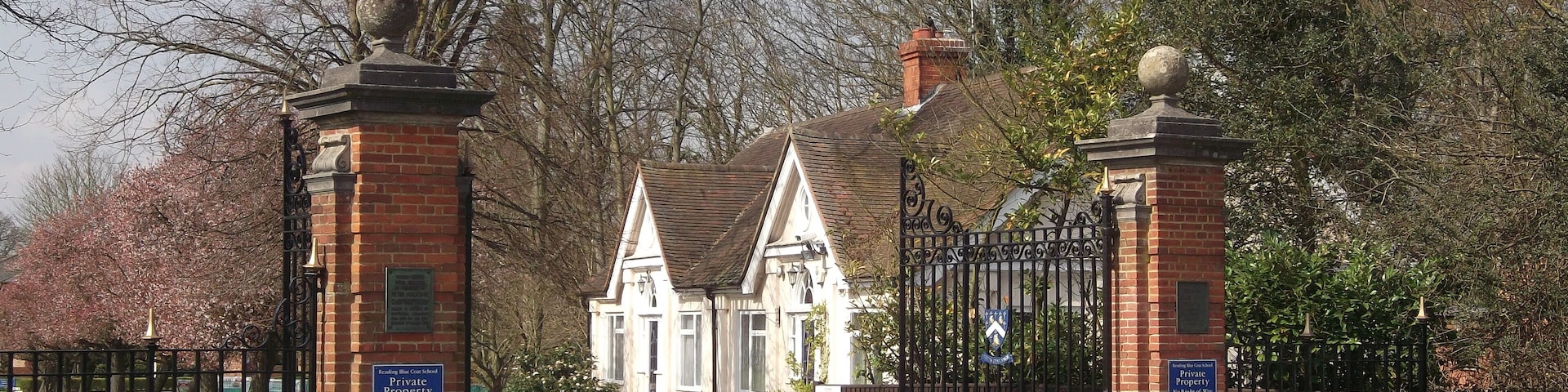 Entrance to Reading Blue Coat School. As seen from Sonning Lane. Beyond the gates is a small lodge.