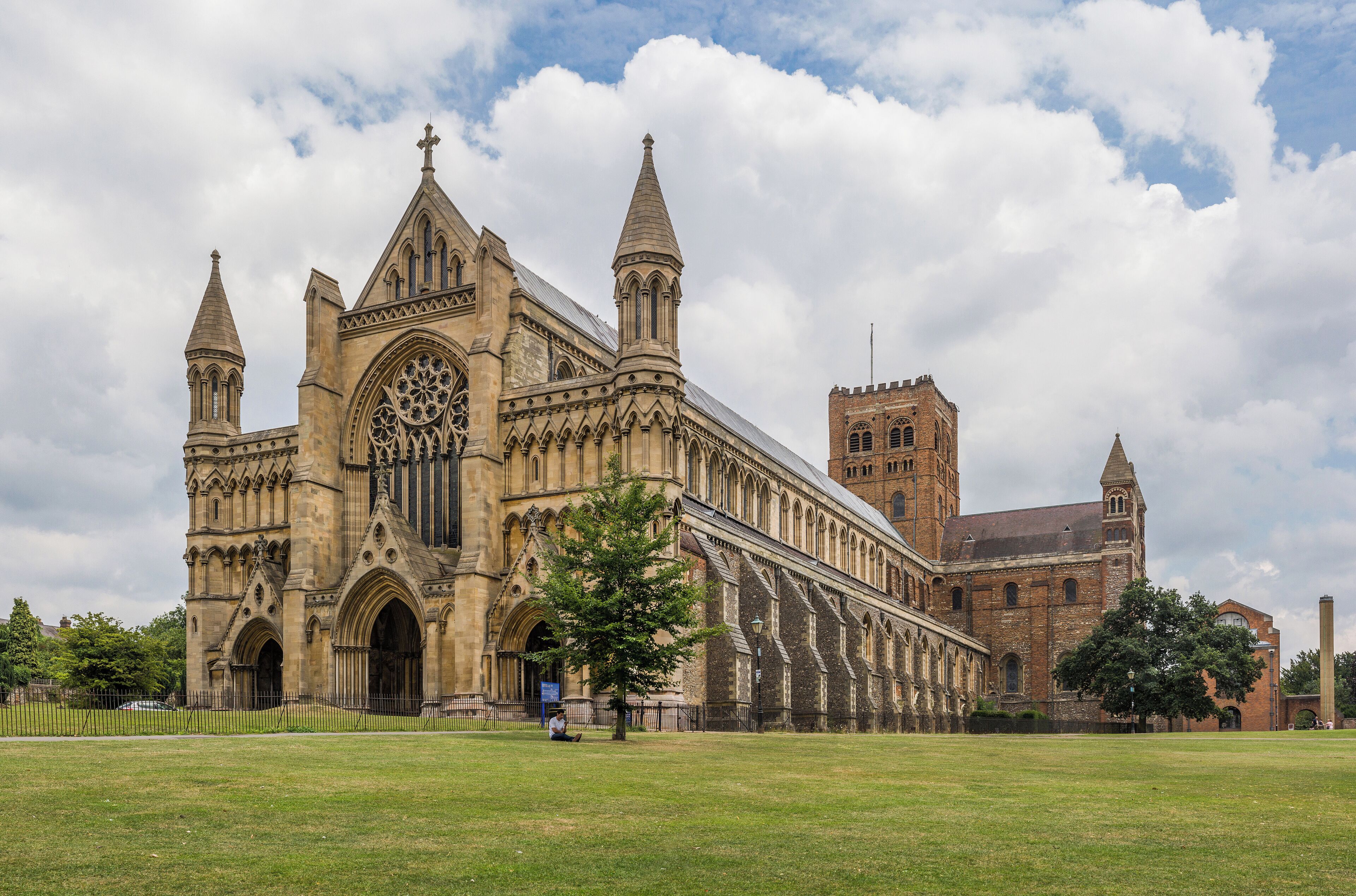 A large historic cathedral with pointed spires and a prominent rose window.