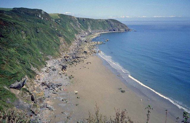 Great Perhaver Beach View north-east along the beach to Pabyer Point. August Bank holiday and there are only four people on the beach. A little tricky to get down to, but proves it is always possible to find a deserted beach in Cornwall.