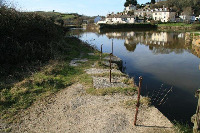 Pentewan Harbour. Quay side with old safety railings, beside the lock gates at the harbour entrance and looking north-west towards Pentewan village.