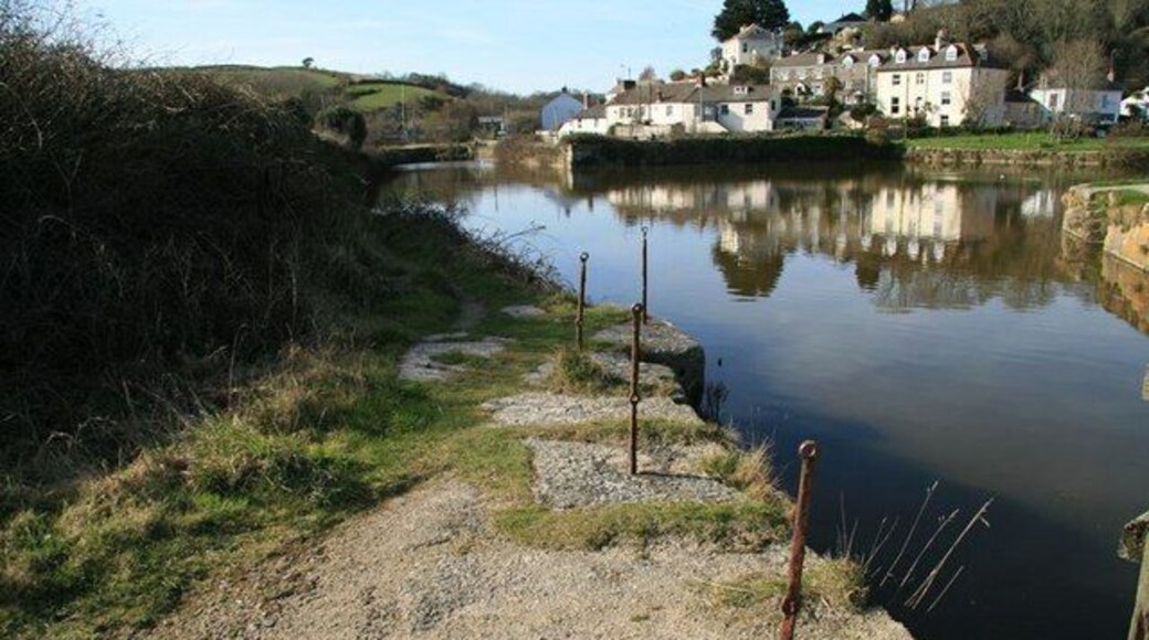 Pentewan Harbour. Quay side with old safety railings, beside the lock gates at the harbour entrance and looking north-west towards Pentewan village.