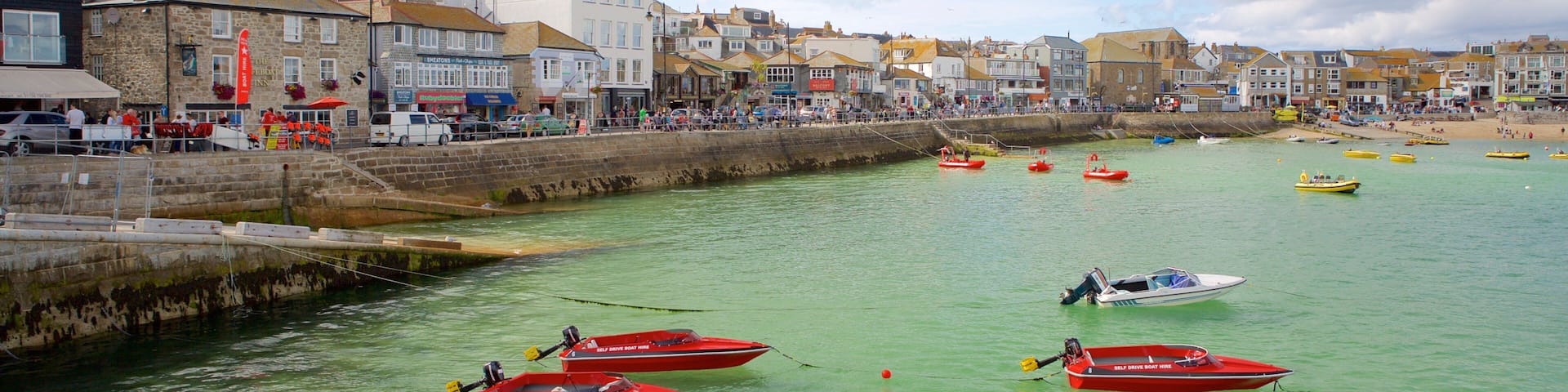 St Ives showing boating, a coastal town and rocky coastline