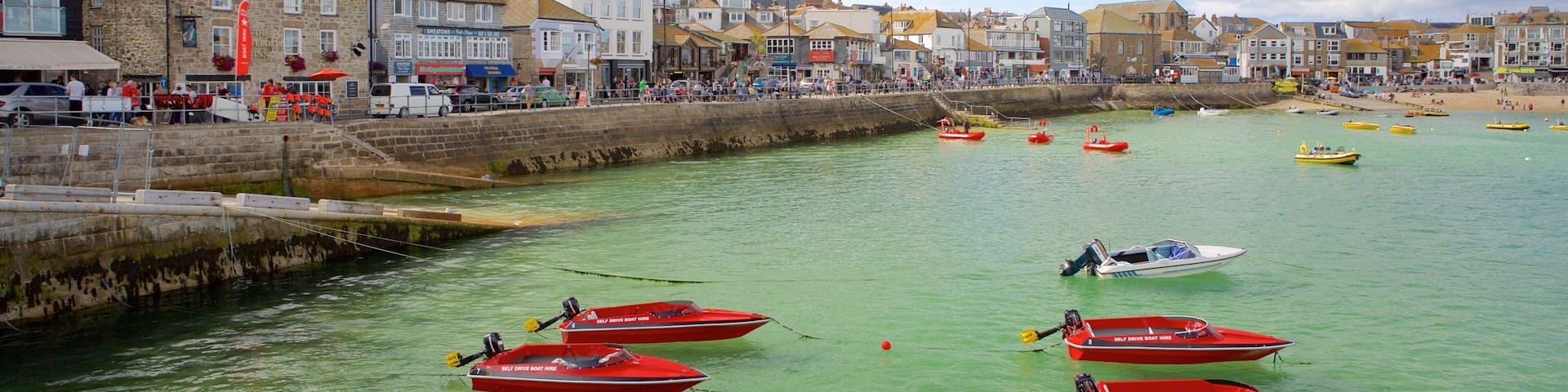 St Ives showing boating, a coastal town and rocky coastline
