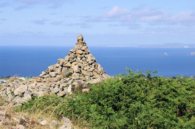 Cairn on Rosewall Hill With Godrevy lighthouse and St Agnes Head in the distance.
