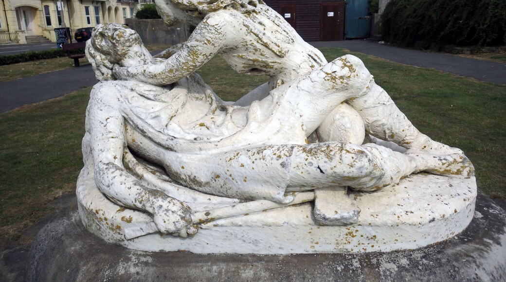 Stone statue depicting King Harold II and his first wife Edith Swan-Neck (1025-1086?). Harold is depicted lying on his back dying and the figure of Edith is hunched over him, holding up his head towards her face. Artist: Charles Augustus William Wilke.