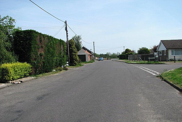 View east along Moor Road The junction seen at right is with Calthorpe Close.