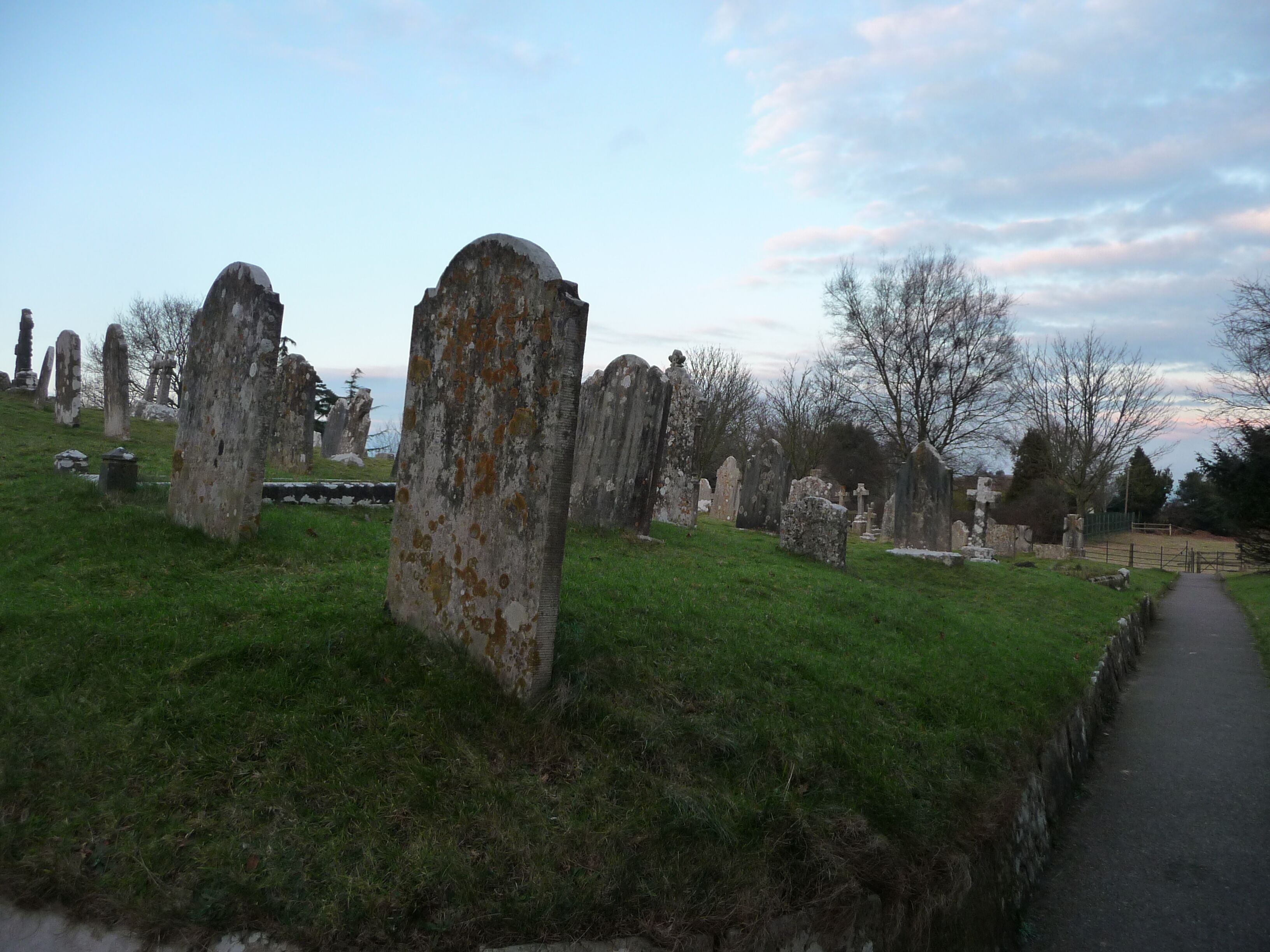 Studland : St Nicholas Churchyard Gravestones in the churchyard of Saint Nicholas.