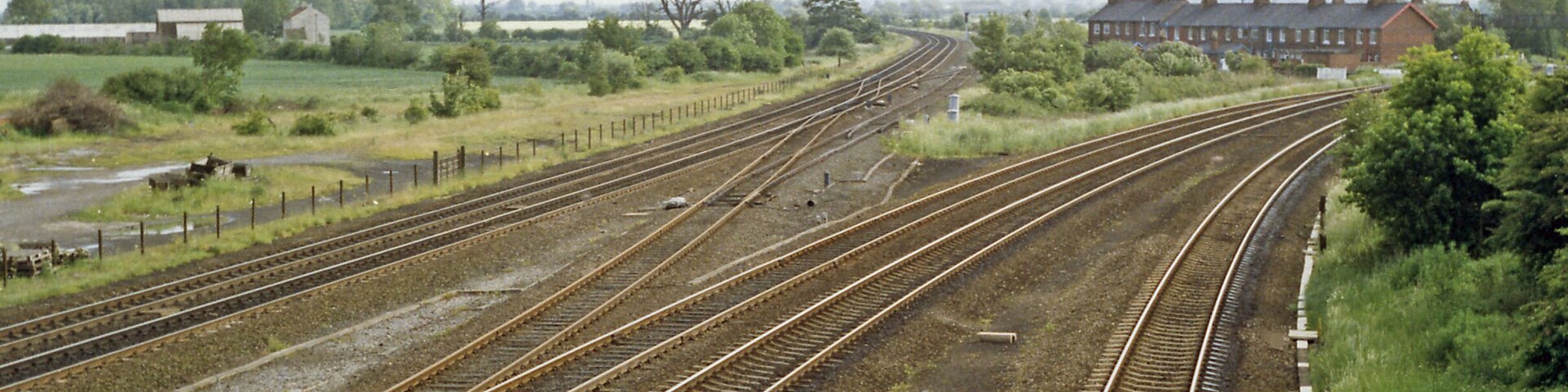 Main lines running south from Church Fenton. View southward from bridge at the south end of Church Fenton station: ex-NER major junction of main lines from York, and from Harrogate via Wetherby, to Sheffield via Pontefract (to the left) and to Leeds (to the right).
