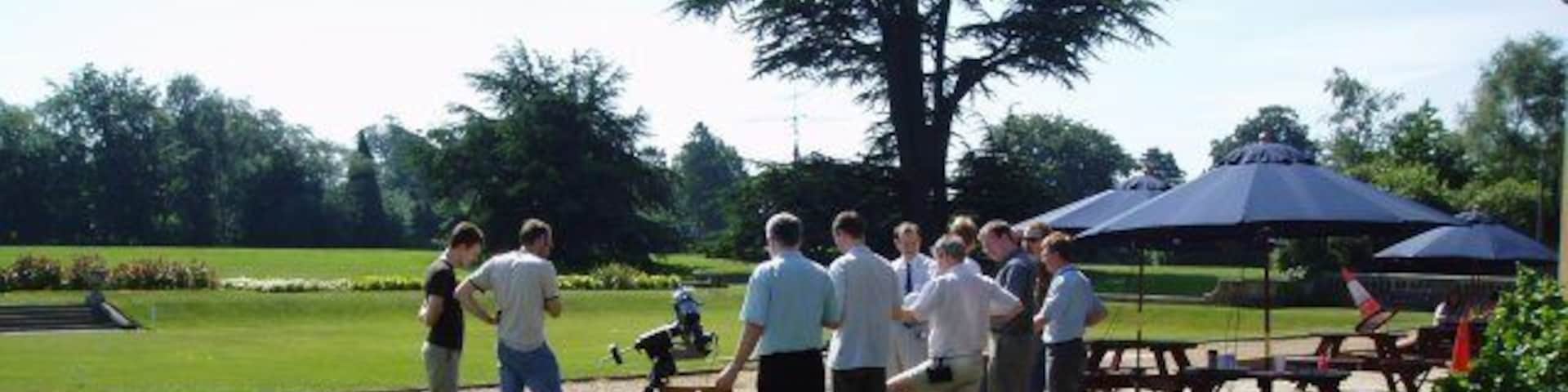 Transit of Venus A group of engineers and scientists gather early in the morning before (possibly) more mundane real work starts, to observe the first transit of Venus across the sun's disc in living memory. The telescope in the picture provided stunning pictures of the entire sequence using digital photography and also through the eyepiece - the actual photos taken can be observed at http://www.jim-easterbrook.me.uk/astro/ap/photo/venus/transit/ Others (including myself, equipped with a pair of binoculars to project the sun's image onto a card) had brought alternative ways of viewing the transit too - but the most innovative "viewing device" can also be seen in the picture - observe the traffic cone experiencing a new purpose as a pinhole camera to the right of the picture! It worked too!