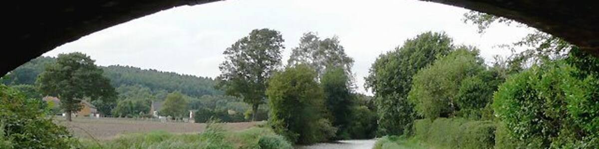 Birmingham and Fazeley Canal south of Hopwas, Staffordshire This is the canal seen from beneath the arch of Ball's Bridge, which carries Hints Lane between Hopwas and Hints Hill. The five and a half mile length of the canal between Fazeley and Whittington was built by the Birmingham and Fazeley Canal Company when the Coventry Canal company ran out of money.