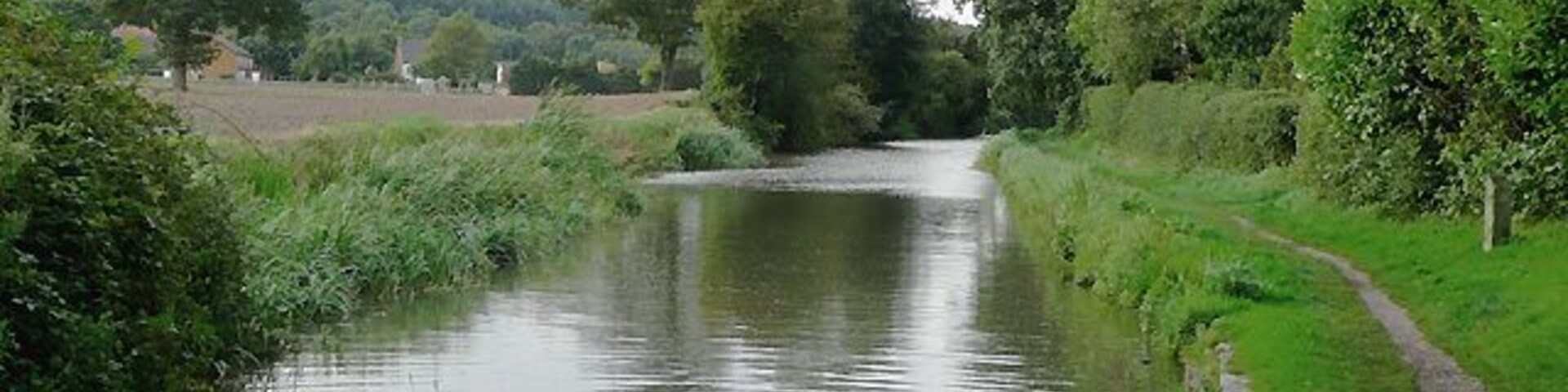 Birmingham and Fazeley Canal south of Hopwas, Staffordshire This is the canal seen from beneath the arch of Ball's Bridge, which carries Hints Lane between Hopwas and Hints Hill. The five and a half mile length of the canal between Fazeley and Whittington was built by the Birmingham and Fazeley Canal Company when the Coventry Canal company ran out of money.