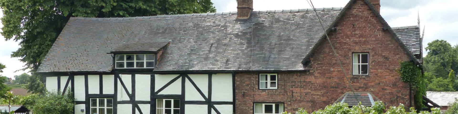 Grade II listed farmhouse in Bunbury, Cheshire. This is a photo of listed building number 1136167.