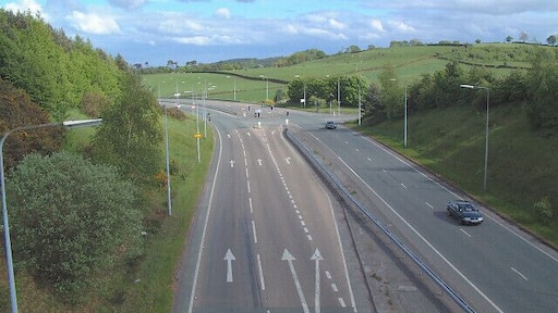 Bridge over A54 at Kelsall Hill. An unusually straight minor road passes over the A54 in the North of the square. The picture is taken from the bridge looking east.