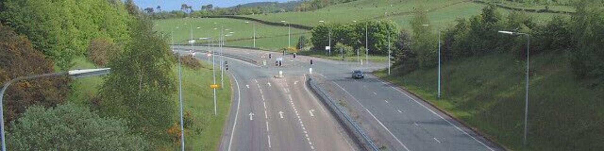 Bridge over A54 at Kelsall Hill. An unusually straight minor road passes over the A54 in the North of the square. The picture is taken from the bridge looking east.