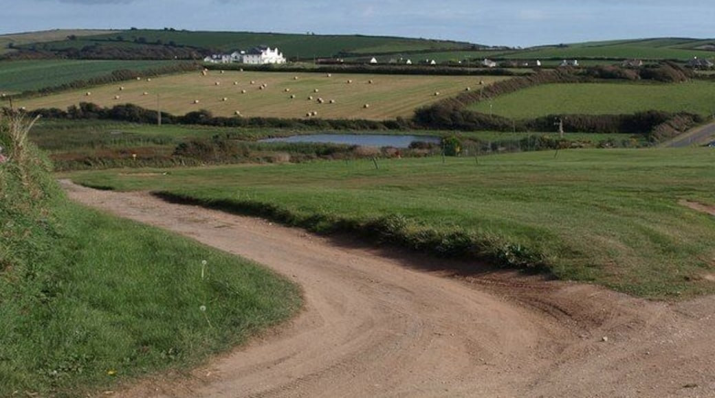 Thurlestone Marsh and Thurlestone Sands House Although the maps shows marshland and drains in the valley floor here, none of them show an actual pool. The wetland is popular with bird-spotters. A view from Thurlestone Footpath 16 at the edge of the golf course.