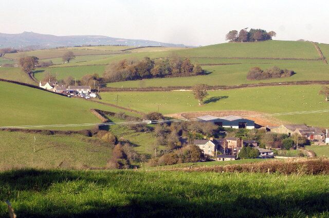 Longcombe farm and Longcombe Cross. Viewpoint south of Longcombe towards Longcombe, middle distance. Haytor, on eastern Dartmoor, is visible on the extreme left horizon