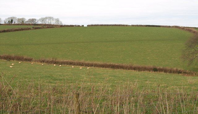 Fields near Langford Barn From the lane between Larcombe End and West Leigh Cross, a view across the shallow valley in which the barn (just off to the right) lies.