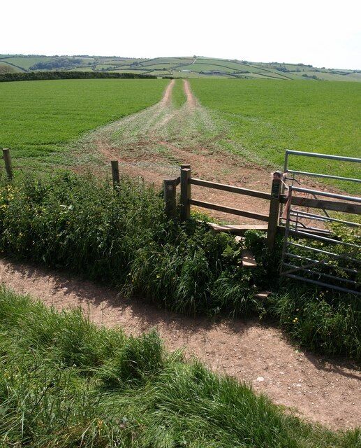 Stile and footpath near Blackawton Taken from a neighbouring stile as Blackawton Footpath 11 crosses the track to an adjacent barn on its way to Washwalk.