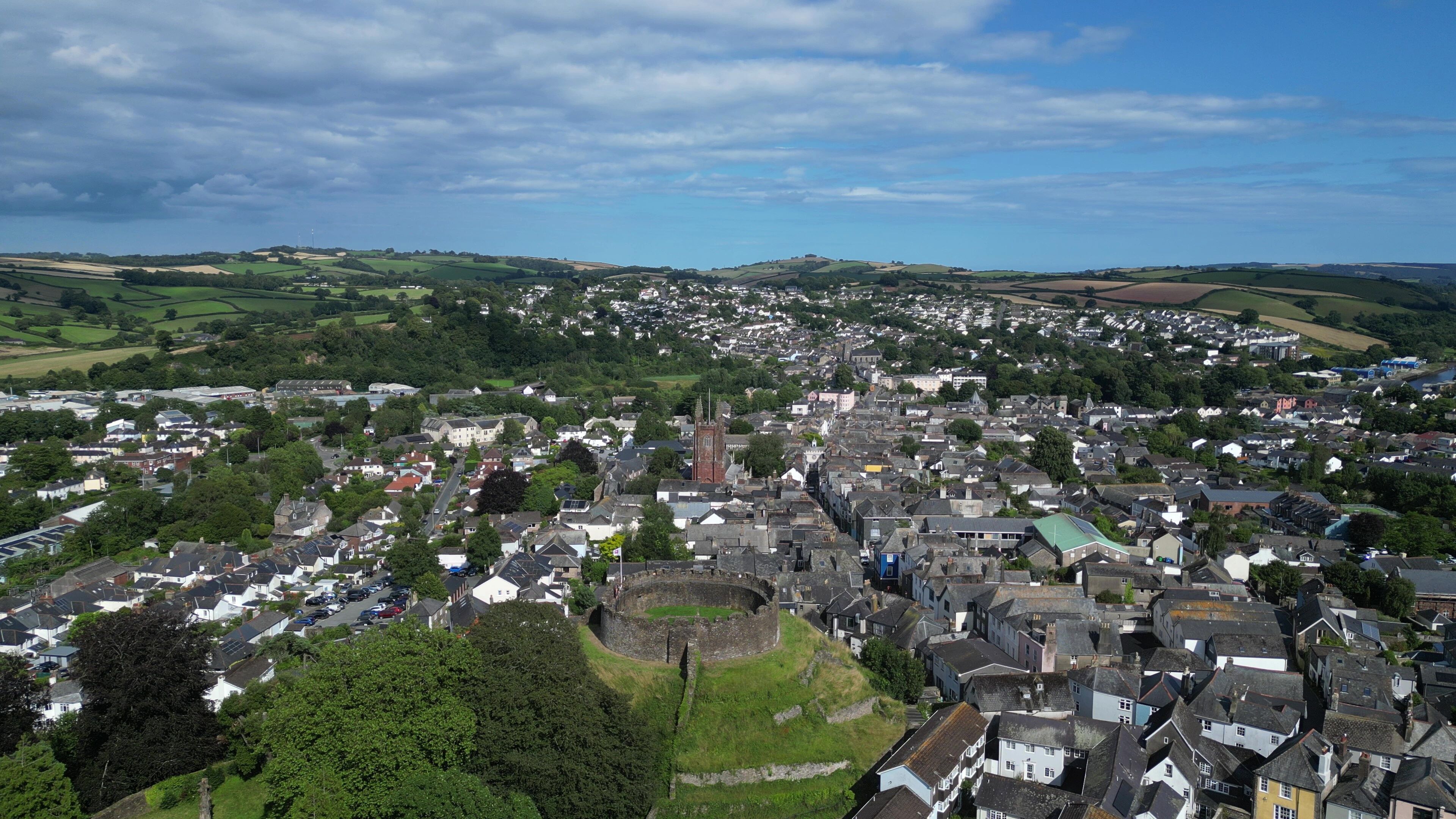 Totnes, South Devon, England: DRONE VIEW: The town centre and historic skyline. Totnes is a market town dating from the 10th century; today its alternative lifestyle attracts many visitors.