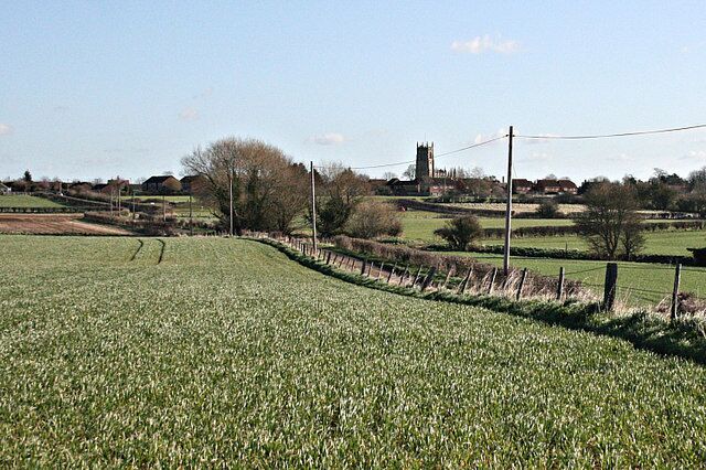 Sandpits Lane (east) Looking east along Sandpits Lane, the parish church at Steeple Ashton is prominent on the skyline.