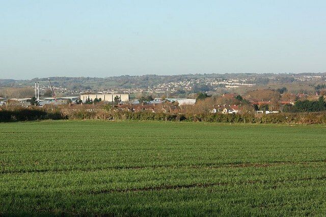 Wheatfield near Hilperton The field is full of newly sprung wheat developing for next year's crop. Houses in the right mid-distance are on Horse Road, Hilperton Marsh. The Kennet and Avon Canal and partly visible Hilperton Marina are about half a mile beyond, and the northern part of Bradford on Avon is spread over the distant hill.