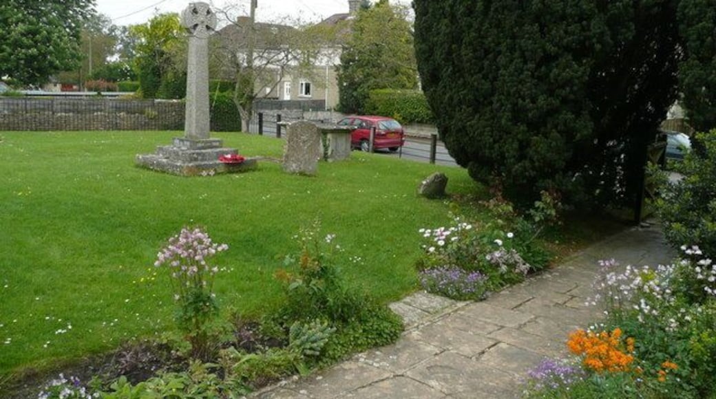 Semington war memorial Positioned in St. George's churchyard, with a good floral display along the path.