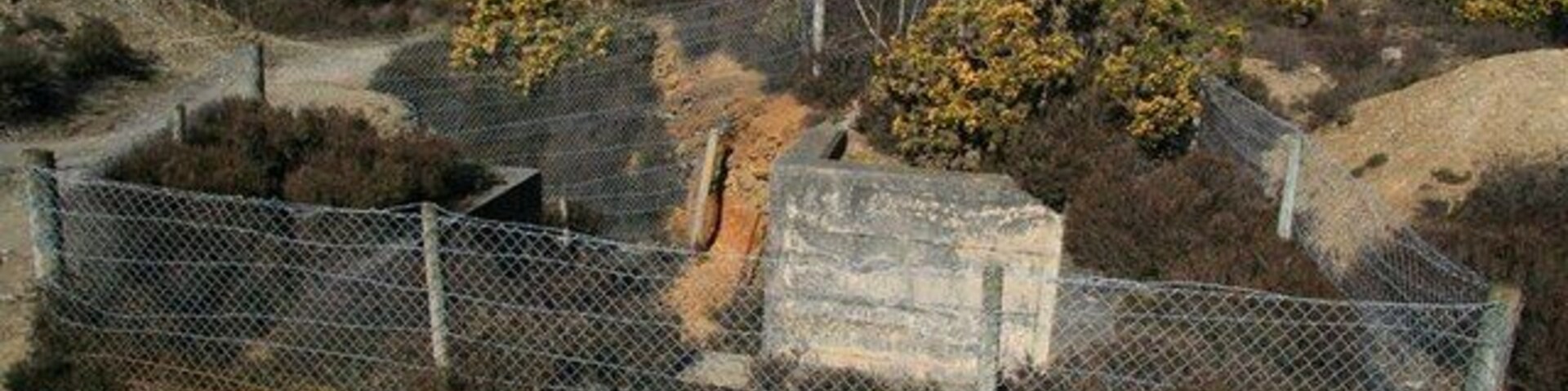 Bread and Cheese Shaft, Nangiles. Adjacent to both the lane and the public bridleway, this open shaft on Nangiles Mine, near to Wheal Edward, is named after the Bread and Cheese mineral lode which traverses the mine sett at this point.