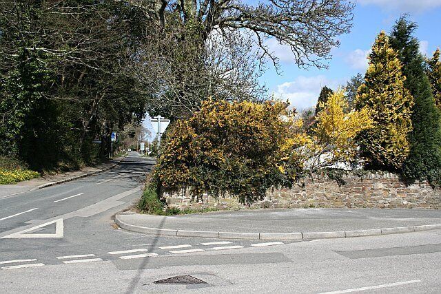 Playing Place. Looking down Old Coach Road at the junction with Holywell Road. Playing Place is a dormitory suburb of Truro composed mainly of 20th century detached houses and bungalows. The name "Playing Place" denotes a place where people used to meet for performances of Mystery Plays and the like.