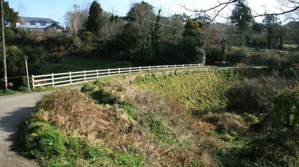 Embankment, Tallack's Creek This embankment at the head of Tallack's Creek once carried the Redruth and Chasewater Railway (1824 - 1915) around what was probably its tightest curve. It now carries the narrow lane known as Old Tram Road between Devoran and Point.