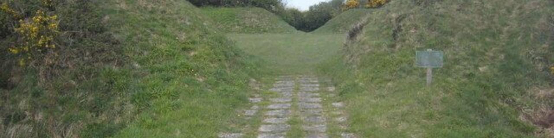 Entrance to St Piran's Round. St Piran's Round is the best surviving example of a plen an gwary - medieval amphitheatre, or playing place. Cornish language miracle plays were enacted in such places in Mid and West Cornwall throughout the Middle Ages. Some believe that this one was constructed solely for this purpose but it does seem likely from its form that it might originally have been an Iron Age or Romano-British enclosure. It is still used for the performance of miracle plays and it has also been used on five occasions in recent years for the staging of the annual Cornish Gorseth.