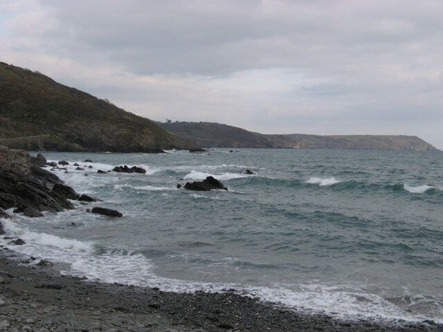 Coastline at Portholland The beach at West Portholland in the foreground, the foundations for East Portholland on the left side and Dodman Point in the background