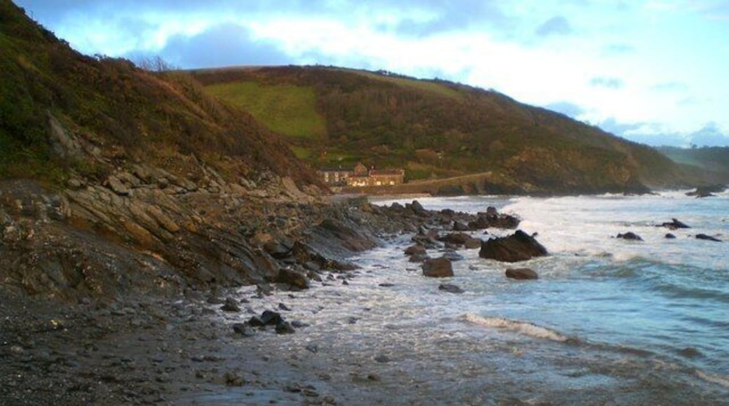 Portholland from West Portholland Portholland is a lovely secluded village by the sea. The beaches of East and West Portholland become one at low tide. The tide is in here, but going out.