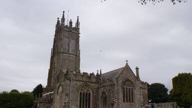 A historic church with a tall tower and Gothic architecture.